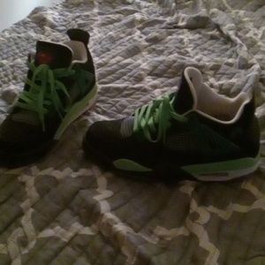 A pair of Jordan shoes superman Jordan size 9.5